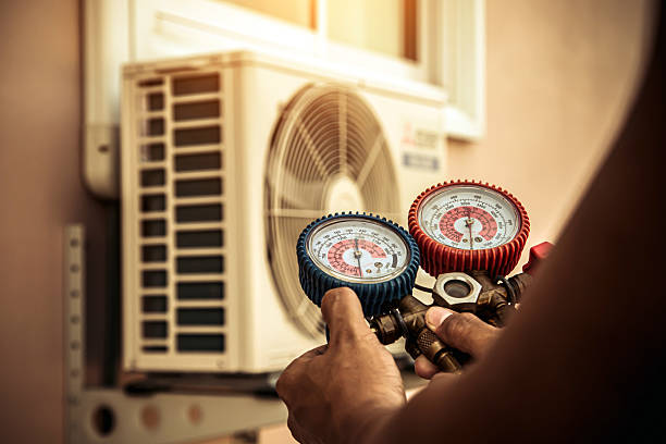 Professional Air Conditioning Service technician working in Rushville, MO